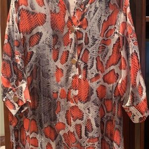 Orange and black snake print. Approximately 34” from shoulder to hem.